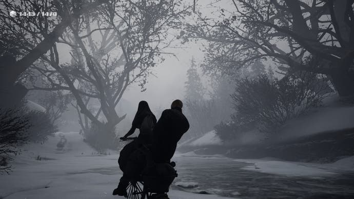 Indika screenshot showing her and a male companion cycling by on the shores of a snowy river