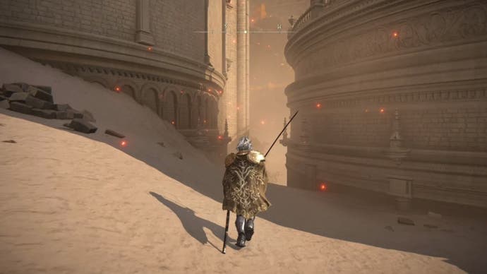 elden ring player walking between buildings in ashen capital