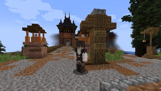 Emma's Minecraft character stands at the beginning of a dramatic bridge leading to a gated land.