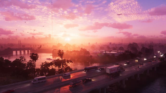 A rose-coloured sky peeks out above the skyscrapers of Vice City in this GTA 6 screenshot.