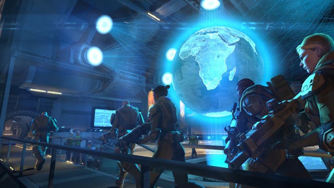 Soldiers walk past a large glowing blue globe in XCOM: Enemy Unknown